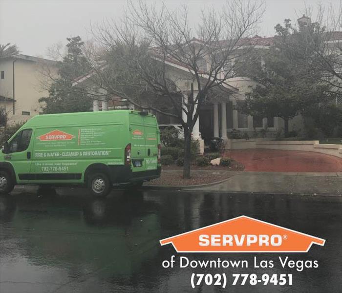 SERVPRO van parked outside a home. 