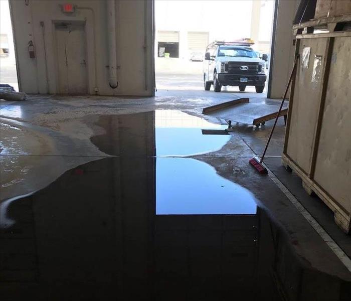 Flooded water in puddles in a warehouse