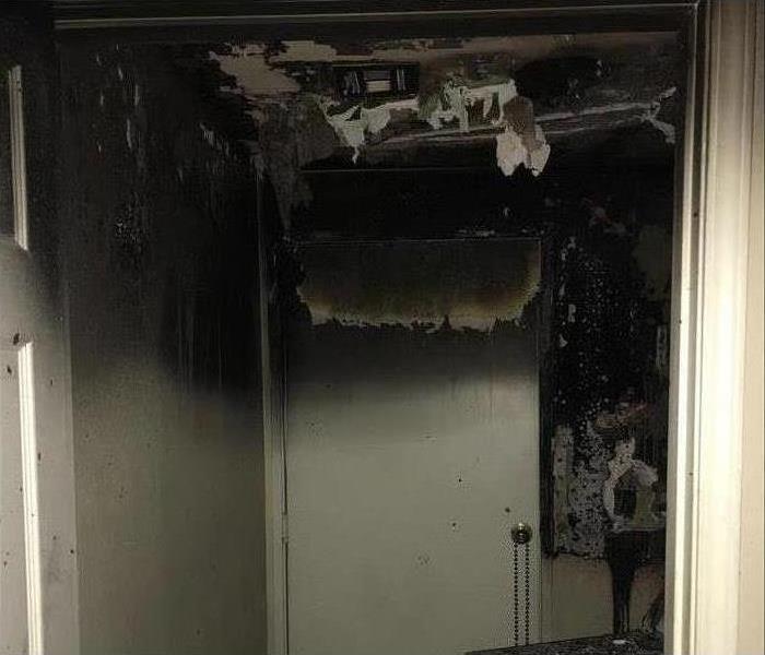 door, burned, ceiling collapsed due to fire damage