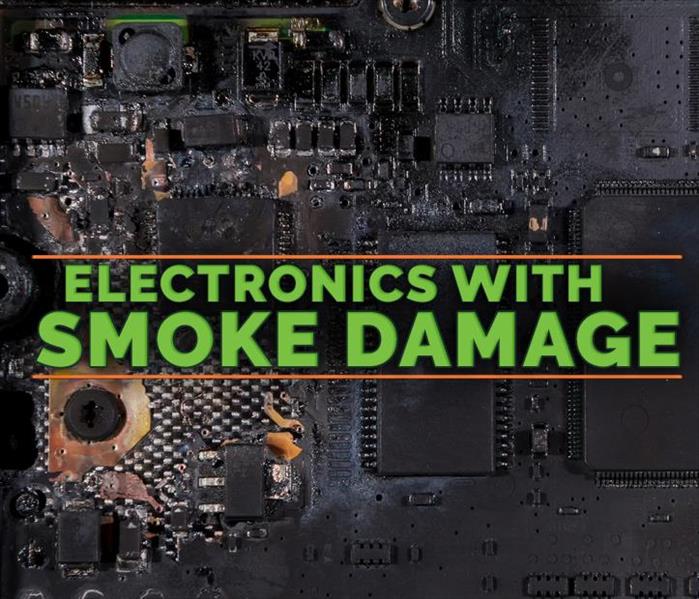 Background of an electronic damaged by fire with the LOGO of SERVPRO