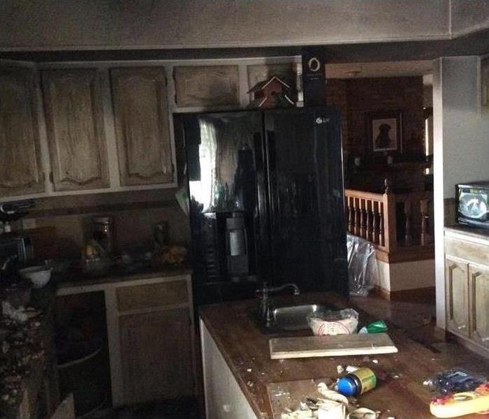 Fire damaged kitchen, kitchen cabinets burned